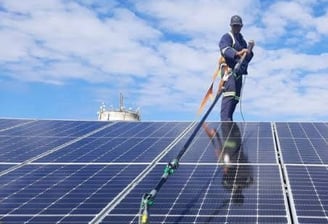 a man in a helmet and a man in a helmet on a solar paneled
