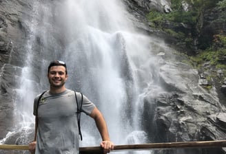 Travel physical therapist enjoying a waterfall on a weekend