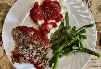 a meatloaf dinner on a plate