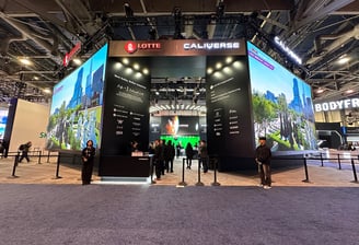 a booth with a large display of a video game