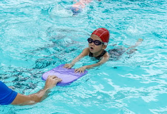 child learning to swim