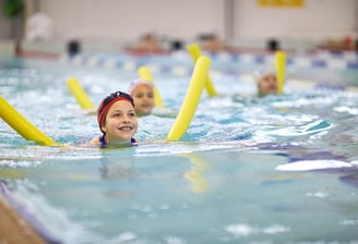 child learning to swim