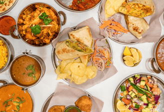 a table with many different types of food and drinks