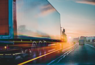 Freight truck on highway at sunrise — fast, flexible logistics and reliable delivery service.