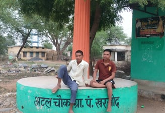 Two people sit on the atal chowk
