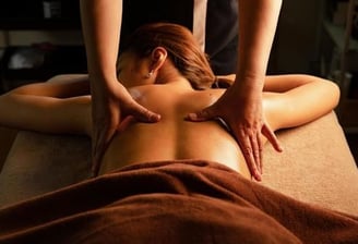a woman getting a massage at a spa
