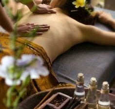 a woman getting a massage at a spa