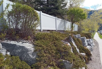 Vinyl fence around multi-unit residential strata complex, Canmore