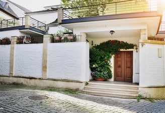 a house with a balcony and a balcony with a balcony