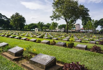 The Kanchanaburi War Cemetery contains graves of prisoners of war
