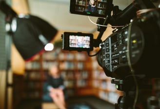 Indoor film shoot with professional camera recording a scene