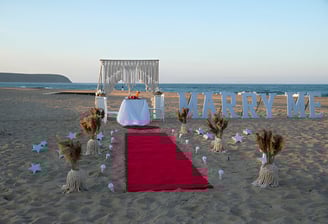 Beach marriage proposal on romantic dinner at sunset