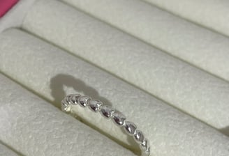 a ring with a diamond ring on top of it