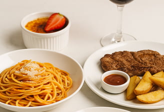 a table with a glass of wine and a glass of wine