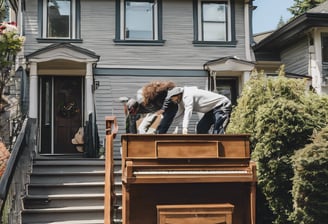 a man and a woman are playing piano together