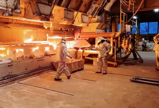 a man and woman working in a factory
