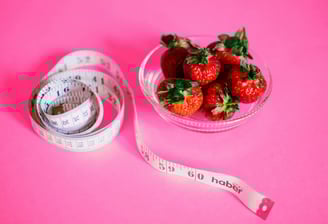 a bowl of strawberries and measuring tape measure tape measure tape measure tape measure tape