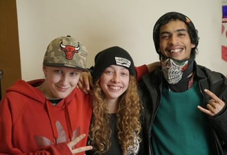 a group of young people standing next to each other at restoring hope ministries