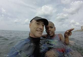 a man and a boy are in the water