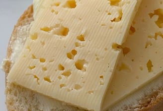Authentic Egyptian Roumy (Roomy) cheese slices on bread  شرائح الجبن الرومي المصري مع الخبز