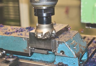 a machine is making a hole in the center of a machine