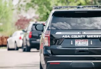 Ada County Sheriff patrol vehicles parked on the side of the road in Boise.