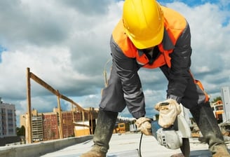 a construction worker is working on a roof top