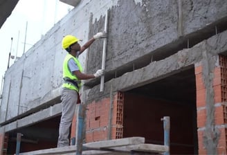 a construction worker is working on a building