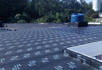 a roof with a blue skylight and a blue skylight