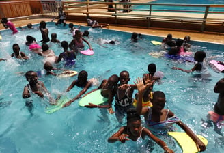 a group of pupils in a swimming pool