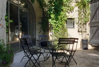 a patio table with chairs and a table