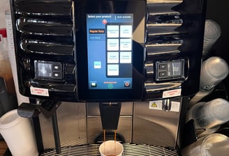 Schaerer Coffee Art Plus espresso machine dispensing coffee at a Starbucks location.