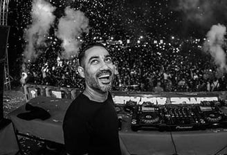 a Dj with a beard at concert of The Kabir Company
