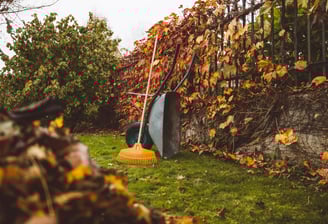 a garden tool with a broom and a broom