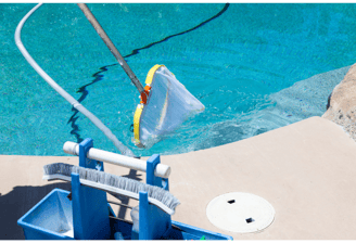 Image of a pool being skimmed and cleaned free of leaves and debris and vaccuumed.
