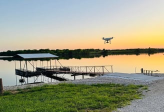 a drone flying over a body of water