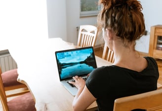 Woman at computer screen at home office