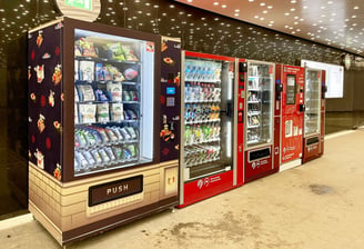 a row of vending machines in a store