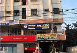 a building with a lot of people walking around dental hospital