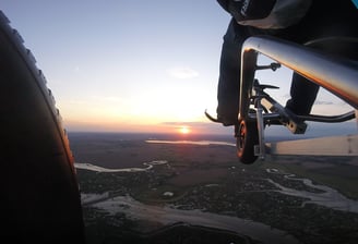 A paramotor trike flying over Mersea Island Essex