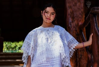 a woman in a white dress with a white dress