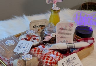 a tray of food and a bottle of wine