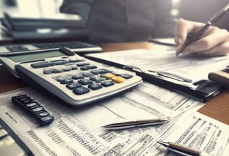 A stack of thick folders on a white surface