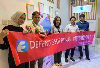 a group of people holding a banner that says defend shipping