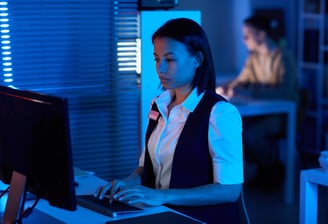 Side view portrait of young woman watching surveillance camera