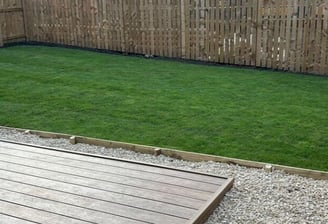 Freshly laid turf and garden edging with raised beds in Bristol