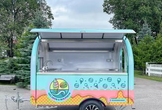 a food truck with a ice cream on it
