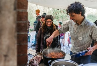 Tom otter from nomad serving food