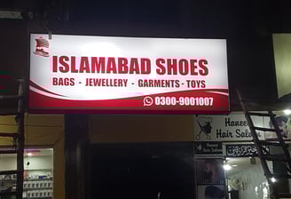 a sign for a shoe shop in a store