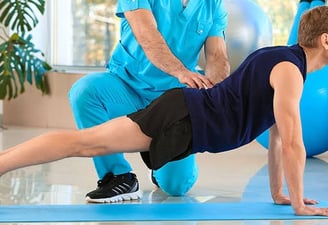 Manual physiotherapy for back pain recovery by expert therapist at home.
